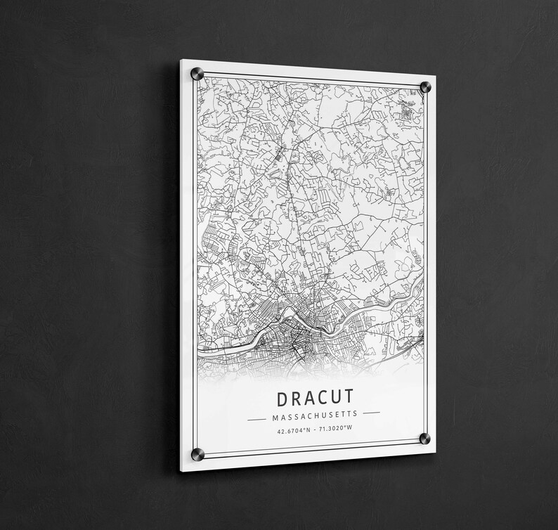 May include: A black and white map print of Dracut, Massachusetts. The map shows the city's streets and landmarks. The text "Dracut, Massachusetts" and the coordinates "42.6704&deg;N - 71.3020&deg;W" are printed below the map.
