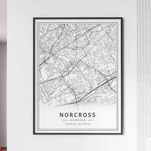 May include: Black and white line art map of Norcross, Georgia. The map shows the city streets and landmarks. The text "Norcross, Georgia" and the coordinates "33.9411°N - 84.2137°W" are printed below the map.