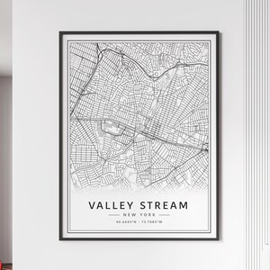 May include: Black and white line art map print of Valley Stream, New York. The map shows the street layout of the town. The text "Valley Stream, New York" and the coordinates "40.6643°N - 73.7085°W" are printed below the map.