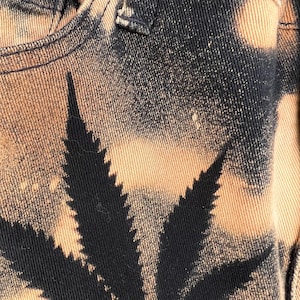 May include: A handmade, wooden serving tray with a natural finish. The tray features a rectangular shape with raised edges and two cut-out handles. The wood grain is visible, showcasing the tray's rustic charm. Dimensions are approximately 16 inches long, 10 inches wide, and 2 inches high.