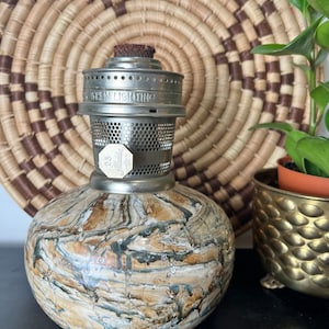 Vintage kerosene oil lamp marked Aladdin 23 with marbled pottery ceramic base