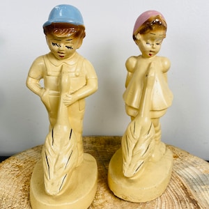 Vintage Chalkware or Carnivalware figurines, Pair of Boy and Girl with a Goose.