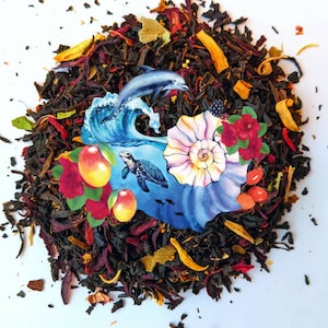May include: A blend of black tea with dried fruit pieces, hibiscus flowers, and a colorful illustration of a turtle swimming in the ocean.