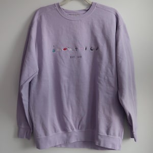 Lavender Embroidered Comfort Colors Sweatshirt – EST. 1989 Symbol Design | Taylor Inspired Crewneck