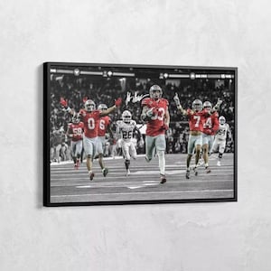 Póster fotográfico de Jack Sawyer capturando un balón suelto en seis ocasiones contra Texas Ohio State