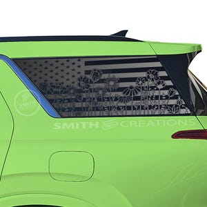 May include: A lime green vehicle with a black and white floral design on the rear window, featuring an American flag motif. The text "SMITH CREATIONS" is visible on the vehicle.