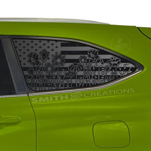 May include: A lime green vehicle with a window decal featuring an American flag design with a floral silhouette. The decal includes the text "SMITH CREATIONS". The design is a patriotic and nature-inspired theme.