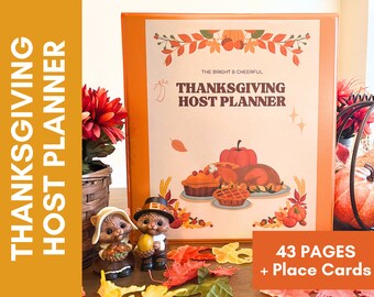 May include: A Thanksgiving Host Planner with a festive orange, brown, and white cover featuring a turkey, pumpkins, and fall leaves. The planner has 43 pages and includes place cards.