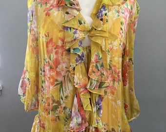 Blusa de seda floral de Ralph Lauren con lazo frontal.