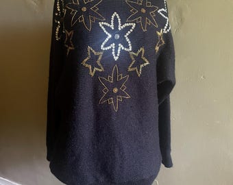 Suéter de estrellas y flores