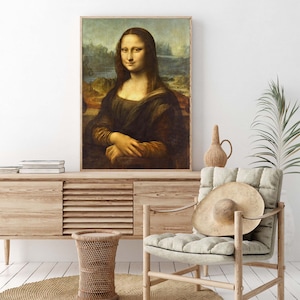 May include: A framed reproduction of the famous Mona Lisa painting by Leonardo da Vinci. The painting depicts a woman with a subtle smile, wearing a dark dress and a light background.