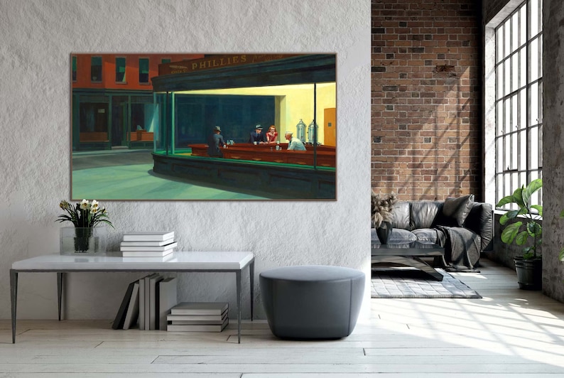 May include: A painting of a diner scene at night. The diner is lit up with yellow lights and there are four people sitting at the counter. The painting is framed and hanging on a wall.
