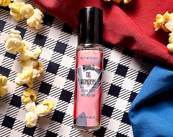 Perfume Caine Digital Circus "World of Wonders" en formato roll-on, con notas de cuero y aceite de menta.
