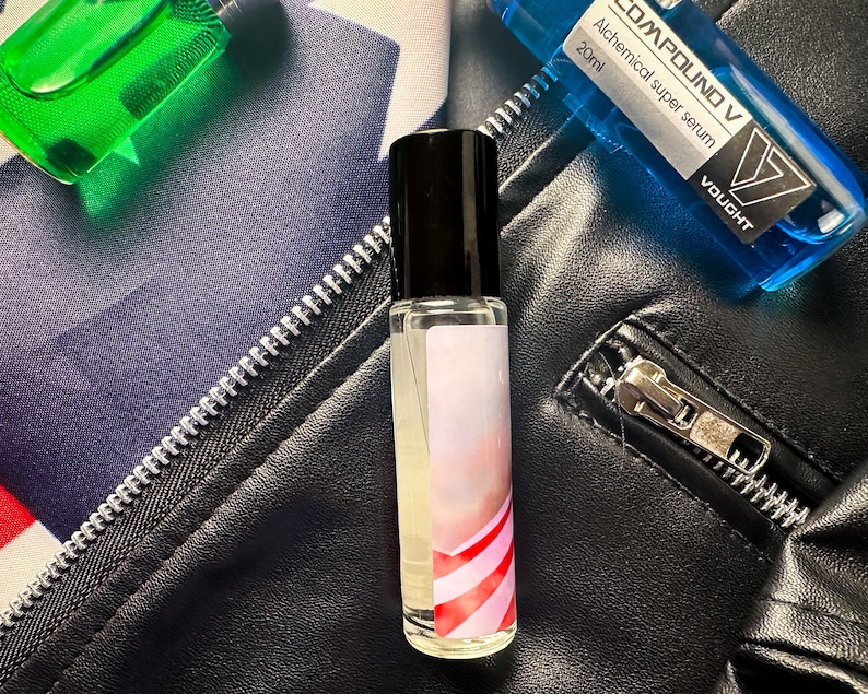 May include: A clear glass bottle with a black cap and a red and white striped label. The bottle is labeled "COMPOUND V Alchemical super serum 20ml VOUCHT".