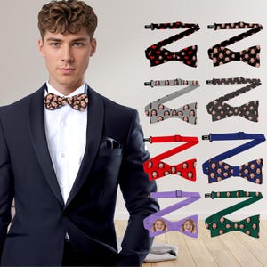 May include: A man in a black tuxedo with a white shirt and a patterned bow tie. The image also shows several bow ties with various designs, including faces, hearts, and solid colours like red, blue, and green. The bow ties are adjustable.