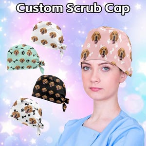 May include: Five different scrub caps with a dog print. The caps are in various colors, including pink, white, black, and green. The caps feature a repeating pattern of a dog's face and paw prints. The text "Custom Scrub Cap" is displayed at the top of the image.