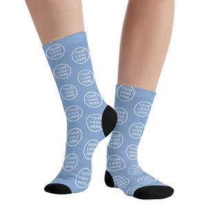 May include: A pair of blue socks with a white repeating pattern of "YOUR LOGO HERE" in a circle.