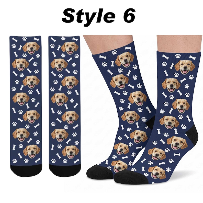 May include: A pair of navy blue crew socks featuring a repeating pattern of a golden retriever's face, white paw prints, and white bones. The text "Style 6" is printed in black at the top of the image. The socks have solid black heels and toes.