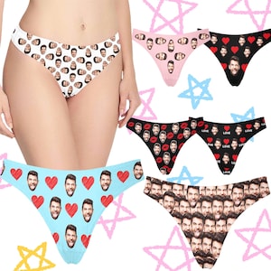 May include: A selection of underwear featuring custom face prints. Styles include white with faces, pink with faces, black with faces and red hearts, black with faces and red lips, light blue with faces and red hearts, and a style with multiple faces.