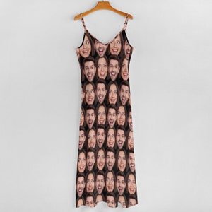 May include: A black sleeveless dress with a repeating pattern of a person's face.