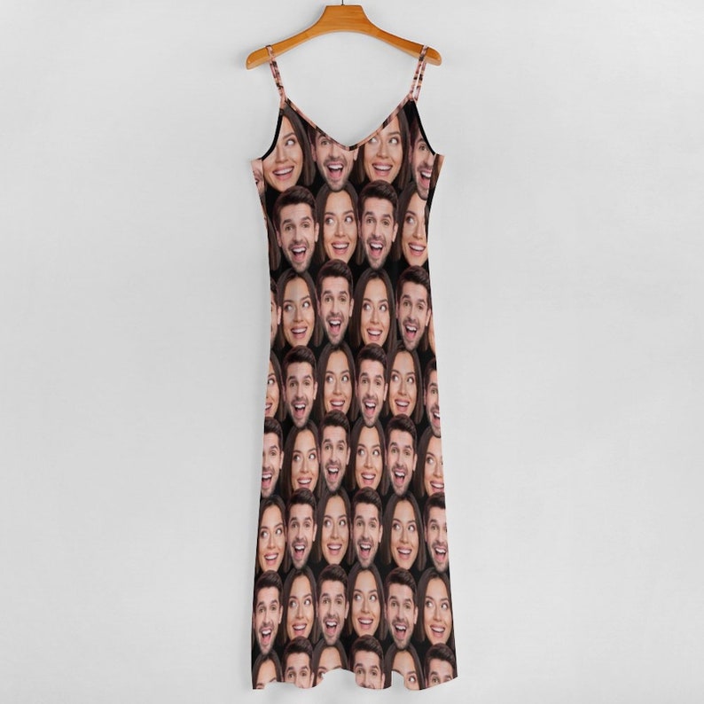 May include: A black sleeveless dress with a repeating pattern of a person's face.