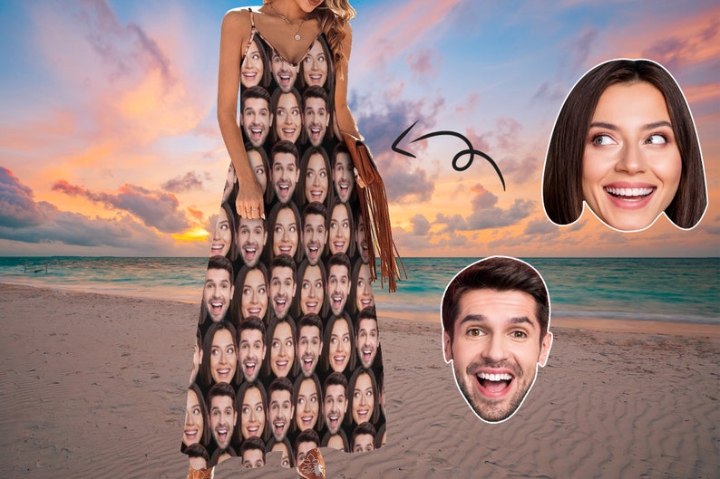 May include: A woman wearing a maxi dress with a pattern of many faces. The dress is brown and black. The woman is standing on a beach with a sunset in the background.
