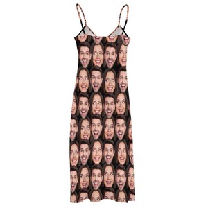 May include: A black sleeveless dress with a repeating pattern of faces. The faces are of a man and a woman, and they are all smiling.