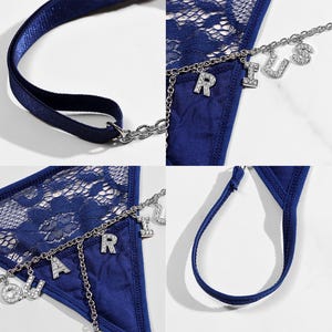 May include: Blue lace lingerie with a silver chain and charms that spell out "AQUARIUS".