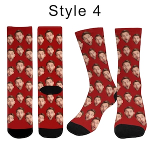 May include: A pair of crew socks with a red background featuring a repeating pattern of a man's face with a surprised expression. The text 'Style 4' is printed in black at the top center of the image above the socks.