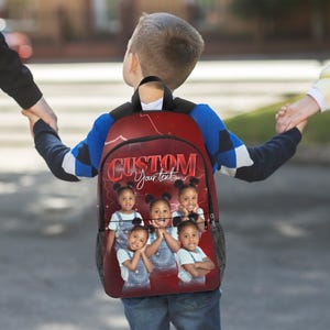 May include: Red backpack with a custom design featuring the word "CUSTOM" and the text "Your text". The backpack has a photo of five young girls. The backpack is being carried by a child.