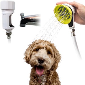May include: A pet shower attachment featuring a white and yellow handheld sprayer with integrated silicone grooming bristles, a white faucet adapter, and a chrome bathtub spout, shown spraying water onto a brown dog.