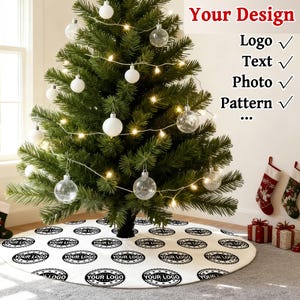 May include: A decorated Christmas tree with white and clear ornaments, and string lights. The tree sits on a white tree skirt with a repeating black logo design. The text "Your Design" and checkmarks for Logo, Text, Photo, and Pattern are visible.