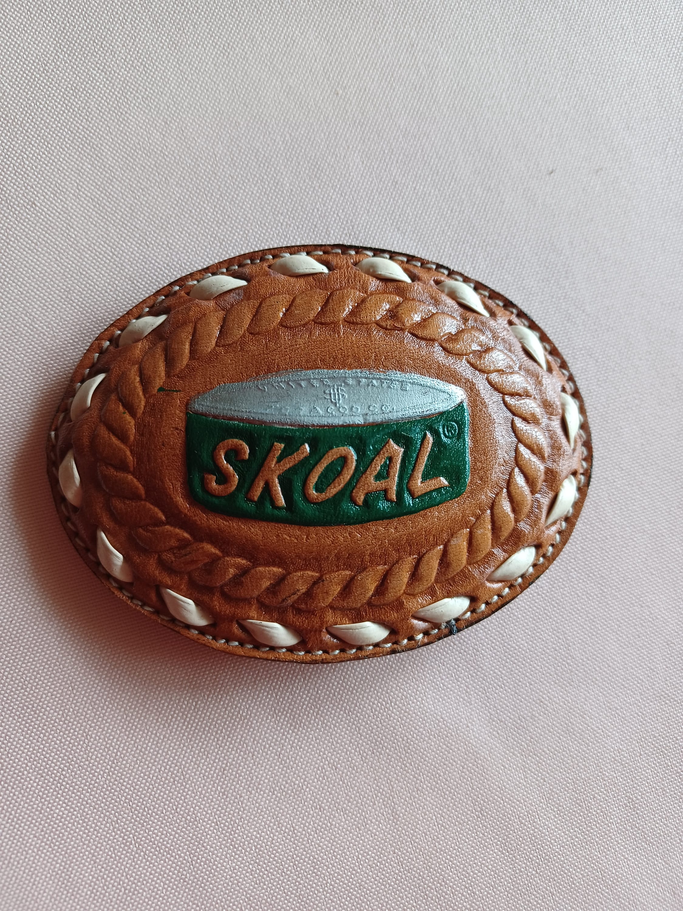 Skoal belt buckle top