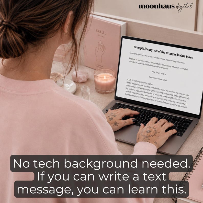 May include: A person typing on a laptop with the text "Prompt Library: All of the Prompts In One Place" on the screen. A pink journal, a lit candle, and the text "No tech background needed. If you can write a text message, you can learn this." are also visible.