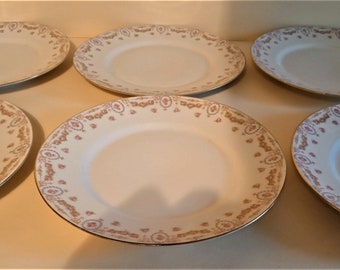 Série de six assiettes en porcelaine française U.C Limoges