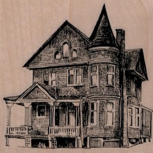 May include: A black and white line drawing of a large, two-story house with a tower on the right side. The house has a porch with railings and a large front door. The house has many windows.