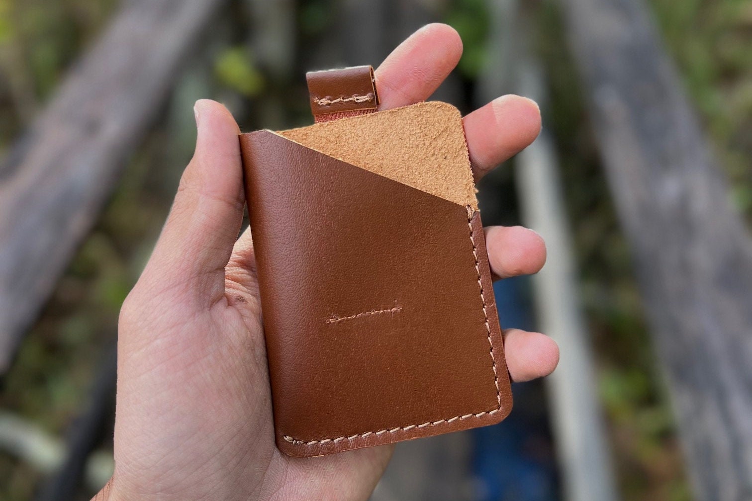 Card holder with a strap