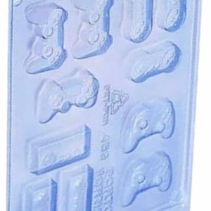 May include: A clear plastic mould for making chocolate video game controllers and game cartridges. The mould has 10 cavities, including different sizes and shapes of controllers and cartridges.