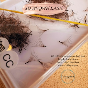 May include: A close-up of a clear plastic container filled with 8D coffee brown volume lash fans. The lash fans are arranged in a fan shape and are approximately 9mm to 16mm in length. The text "8D BROWN LASH" is visible in the top center of the image. The text "8D coffee brown volume lash fans" is visible in the bottom right corner of the image. The text "length: 9mm-16mm" is visible below the text "8D coffee brown volume lash fans". The text "Total: ~500 fans/box" is visible below the text "length: 9mm-16mm". The text "Color: Coffee brown" is visible below the text "Total: ~500 fans/box". The text "Taiwan Lashes" is visible in the bottom right corner of the image.