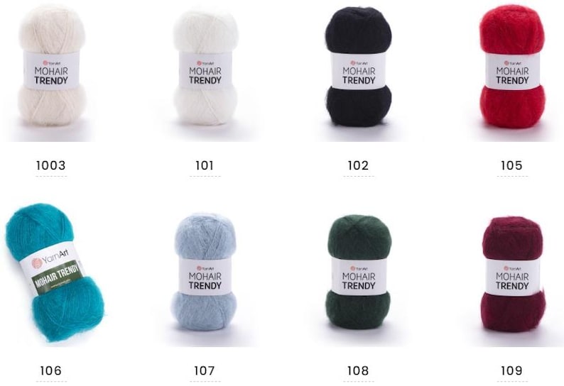 May include: Eight balls of YarnArt Mohair Trendy yarn in a range of colours. Shades include white, black, red, teal, light blue, dark green, and burgundy. Each ball has a label displaying the brand name and a colour number.