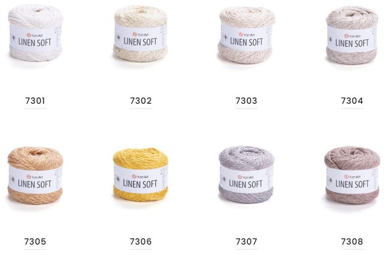 May include: A collection of eight spools of yarn in various colors, including white, beige, light gray, and brown. Each spool has a label that reads "LINEN SOFT" and a unique number.
