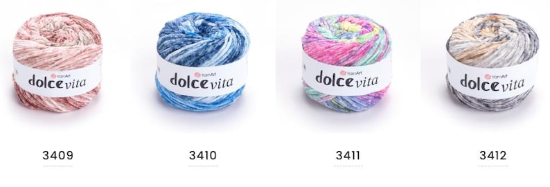 May include: Four skeins of Dolce Vita yarn in various colors. The skeins are labeled with the brand name and color numbers 3409, 3410, 3411, and 3412. The yarn colors include pink, blue, multi-colored, and gray.