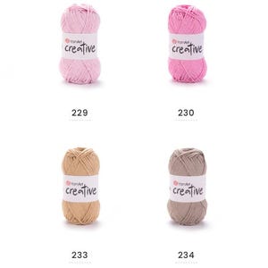 May include: Eight balls of yarn in a variety of colours, including yellow, pink, brown, beige, grey, and green. Each ball has a white label with the word "creative" printed on it. Numbers 228 to 235 are printed below each yarn ball.