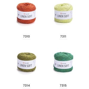 May include: Eight skeins of YarnArt Linen Soft yarn in various colors. The colors include brown, orange, yellow-green, light gray, olive green, dark green, and blue-gray. Each skein has a white label with the text "LINEN SOFT" and a number.