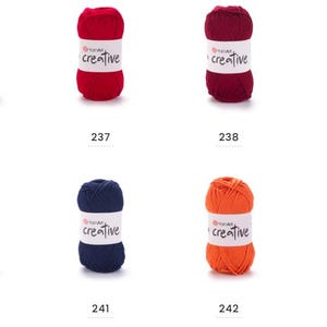May include: Eight balls of colourful yarn are displayed. Each ball has a white label with "creative" printed on it. The yarn colours are pink, red, burgundy, blue, navy, orange, and fuchsia. Numbers 236 to 243 are visible on the image.