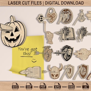 May include: A collection of laser cut file designs featuring a pumpkin with a knife, a heart-shaped lock with a key, a fish hook, a spider on a book, a skull with a dagger, a heart with an arrow, a dragon shield, a planet, a moth, and helmets.