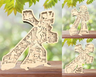 Può includere: Croce di legno con intricati disegni tagliati al laser che rappresentano la storia di Gesù Cristo. La croce presenta scene della natività, della crocifissione e della resurrezione. Il testo "È risorto" è inciso sul fondo della croce.