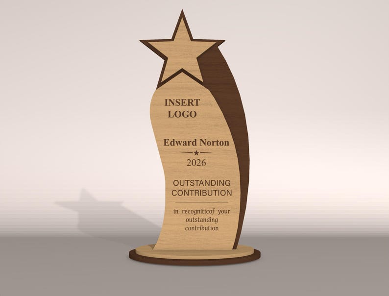 May include: A wooden award trophy with a star on top and a curved body. The trophy has the text "INSERT LOGO", "Edward Norton", "2026", and "OUTSTANDING CONTRIBUTION". The base is round.