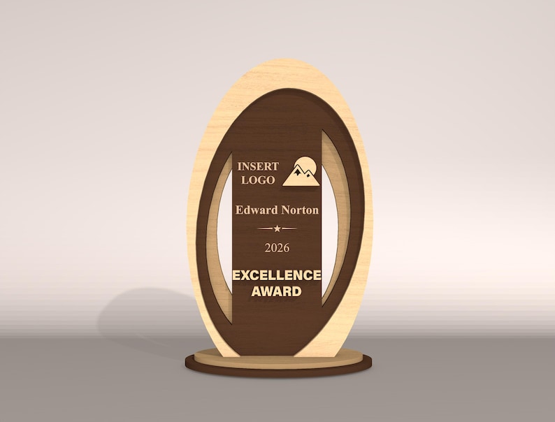 May include: A wooden Excellence Award with a light wood oval frame and a dark brown center. The center includes the text "INSERT LOGO", "Edward Norton", "2026", and "EXCELLENCE AWARD". A mountain and sun graphic is also present.