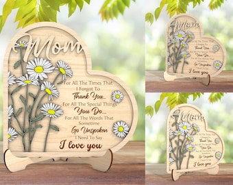May include: Wooden heart-shaped plaque with a floral design and the text "Mom" and "For All The Times That I Forgot To Thank You... For All The Special Things You Do... For All The Words That Sometime Go Unspoken I Need To Say I Love You".